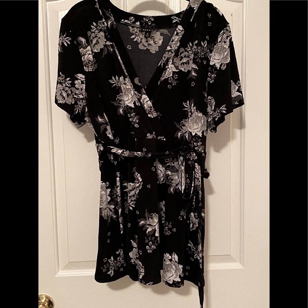 Black floral crepe peplum blouse.